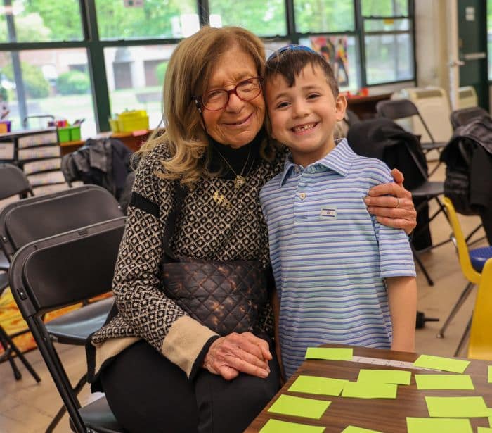 grandmother and young boy at school