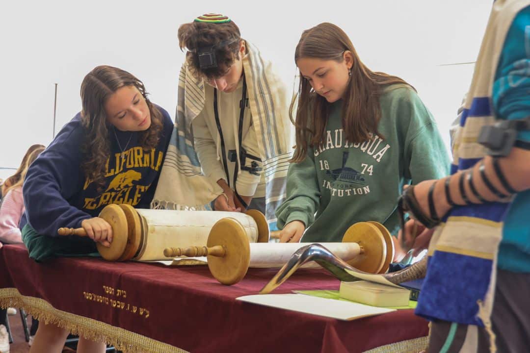dedicated-4 group of Jewish students with Talmud