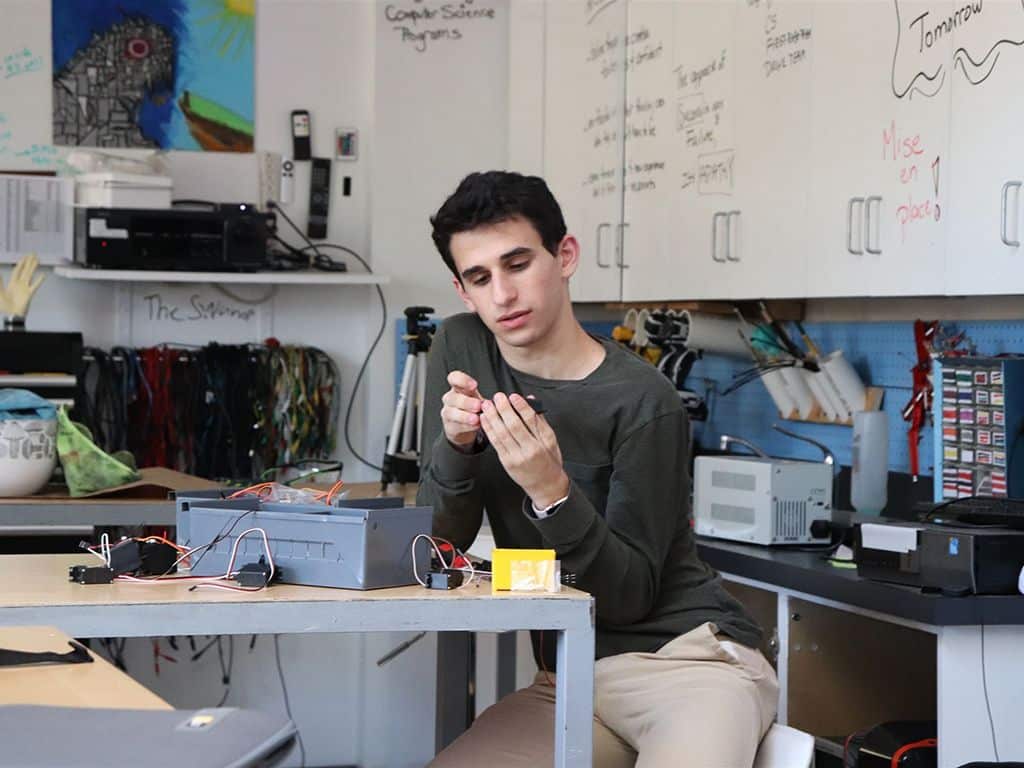 A male student working in a lab