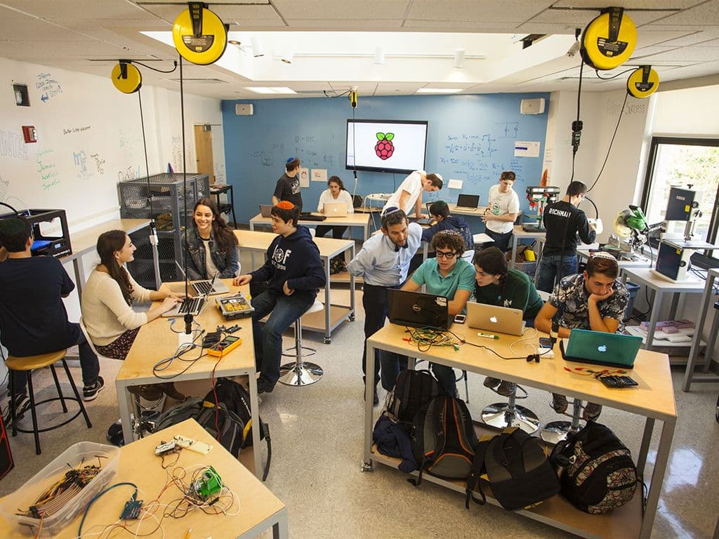 A lab room filled with students working on their computers
