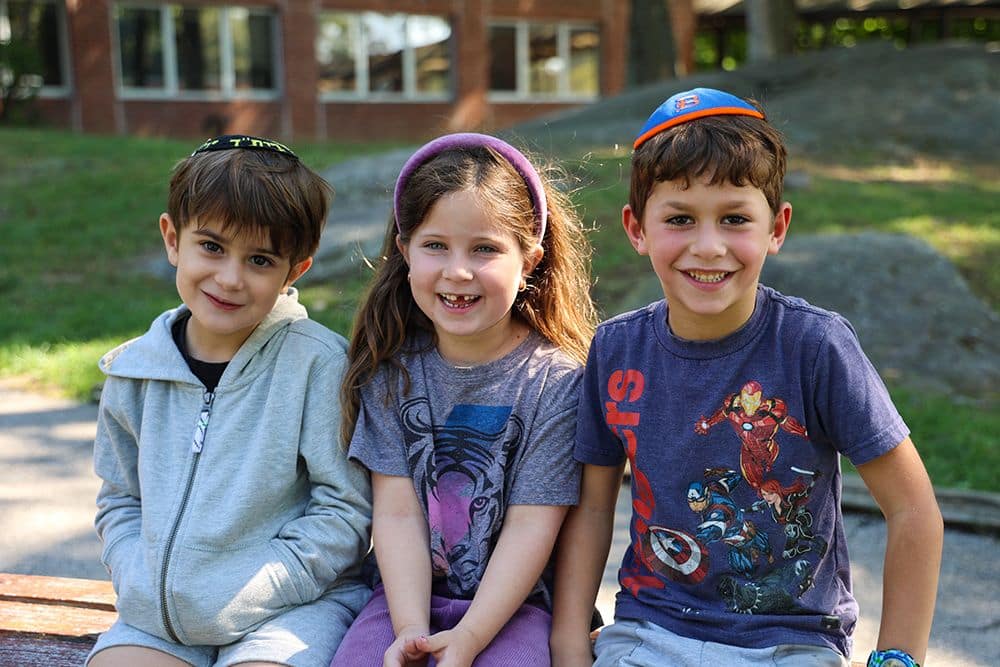 Supporting leffel Three kids smiling